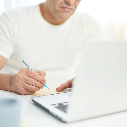 Man Sitting at Laptop